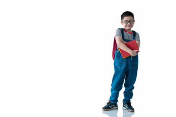 Asian school boy holding book and smiling at camera on white background, with clipping path