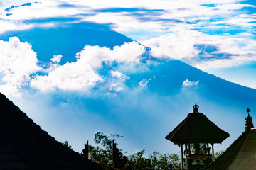 Parts of Lempuyang temple in the island of Bali, Indonesia, with the gunung agung volcano on the background.