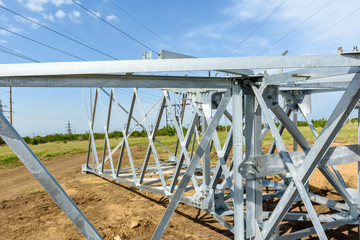 High voltage electric pillar from under. A high-voltage electricity tower