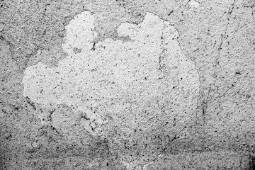 Texture of a concrete wall with cracks and scratches which can be used as a background
