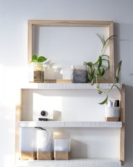 White and wooden shelves furniture and in stylish a room. Dapple light during sunrise. Scandinavian modern korean style.