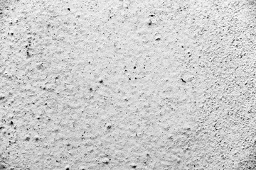 Texture of a concrete wall with cracks and scratches which can be used as a background