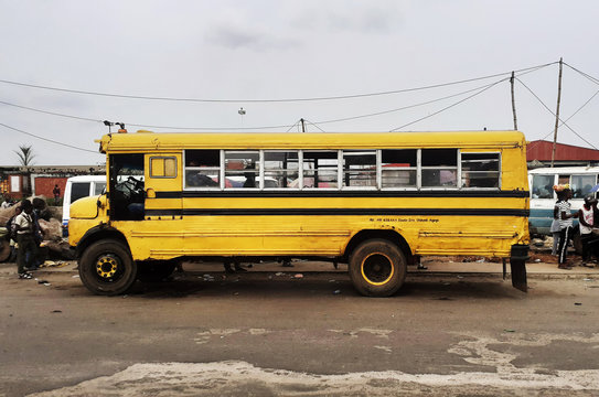 vintage Lagos yellow commercial danfo bus on the road