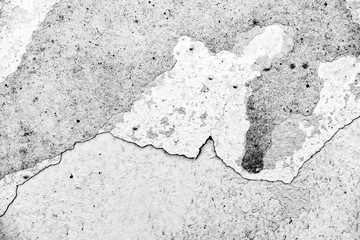 Texture of a concrete wall with cracks and scratches which can be used as a background