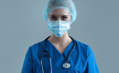 Professional medical worker in protection suit. Nurse, surgeon, doctor or paramedic in blue uniform. Emergency medicine and ambulance.