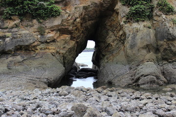 A grotto in a rock by the ocean. USA.