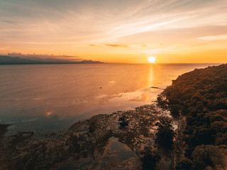 Sunset in low tide beach captured with drone