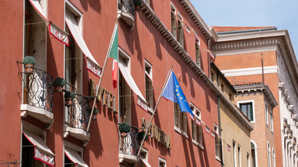 European Union and Italian flag on a decorative building in Venice, Italy