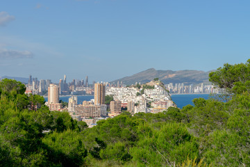 Fototapeta na wymiar Panorama of Benidorm city skyscrapers, Mediterranean sea natural parks and mountains, Benidorm Spain