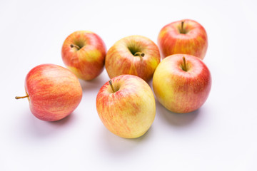 Ripe, red apples on a white background. Farm fruits