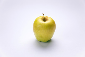 Ripe, green apples on a white background. Farm fruits