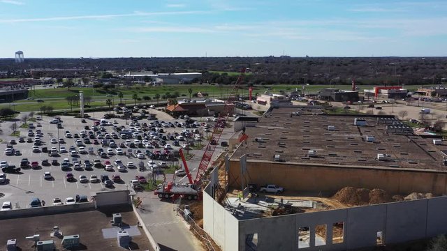 A Construction Crane Setting Wall Panel with a Window, Bryan, Texas, USA