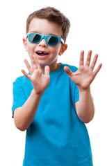 Little boy in sunglasses raised his hands up, isolated on white background