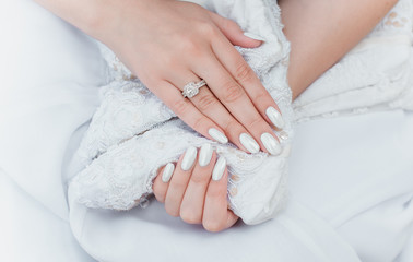 Wedding white pearl manicure, close up, beauty details 