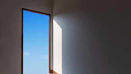 Open big door on wall against blue sky, hope concept