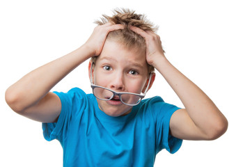 Terrified blond hair boy in glasses clutched at his head, isolated on white background
