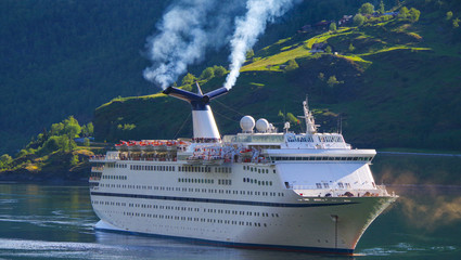 Cruiseship or cruise ship liner in Flam, Norway during cruising to Norwegian Fjords in...
