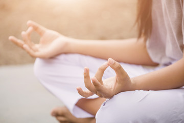  woman enjoying meditation and yoga in the park