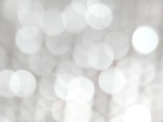 White and silver blur abstract background with bokeh lights for background 