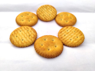 Stack of sweet meal digestive biscuits isolated on white