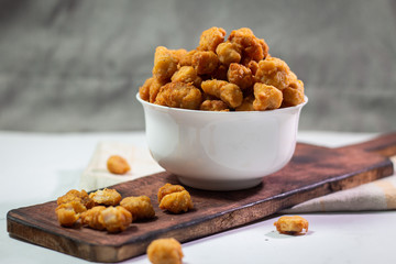 Stock photo of Homemade Crispy Popcorn Chicken with Sauce on white background