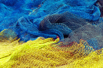 Commercial yellow and blue color fishing nets background