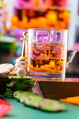 cocktail glass on the casino gambling table