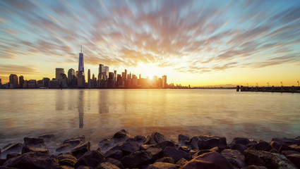 Fototapeta premium New York City skyline with urban skyscrapers at sunset