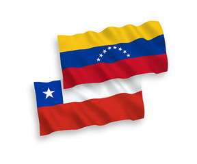 National vector fabric wave flags of Venezuela and Chile isolated on white background. 1 to 2 proportion.