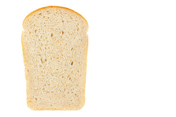 A slice of fresh white wheat bread close-up on a white background.