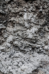 Naklejka premium Old dirty wall uneven texture. Vintage or grungy white background of natural cement & stone texture as retro pattern wall. It is a concept design. Metaphor banner, material aged, rust or construction.