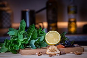 Fruits and kitchen herbs still life in the kitchen