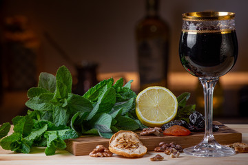 Fruits and kitchen herbs still life in the kitchen