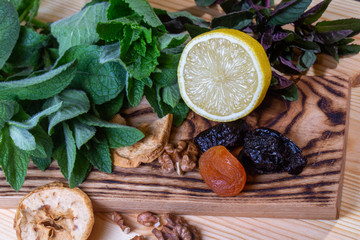 Fruits and kitchen herbs still life in the kitchen