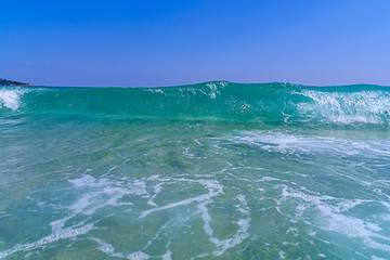 Big sea wave with clean blue sky background