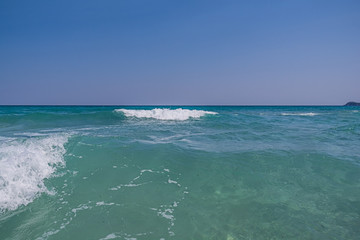 Clear sea water with clean blue sky