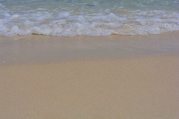 Close up small tide bubble and wave of sea to beach