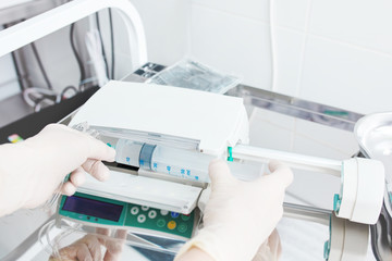 Electronic drug perfusion system (syringe pump) in the modern equipped critical care unit. - obrazy, fototapety, plakaty