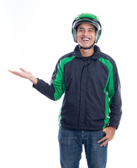 portrait of male motor taxi driver or rider with his uniform presenting to copy space isolated over white background