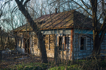 abandoned wooden house in a dead village in the Chernobyl exclusion zone