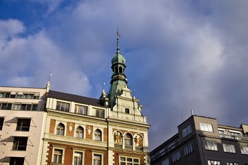 Obraz premium Old bohemian building with spire on the tower and beautiful decorations (Prague, Czech Republic, Europe)