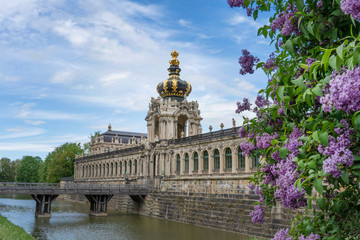 Fototapeta na wymiar Dresden Zwinger Palace, Water Moat and Towers From Outside in Spring