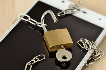 Open padlock with chain on mobile phone - Concept of phishing and security on mobile phones