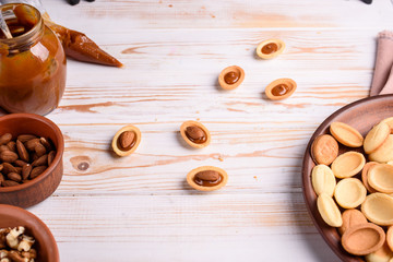 Homemade Russian nuts with condensed milk and mascarpone on a light blue background, wafer napkin....
