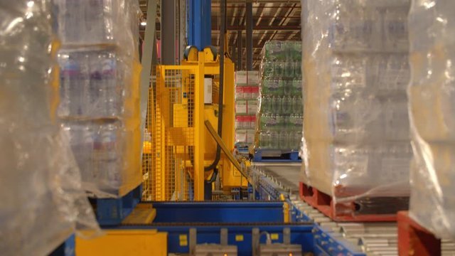 Engine lifting down Packages of Bottle in a Warehouse/Factory 