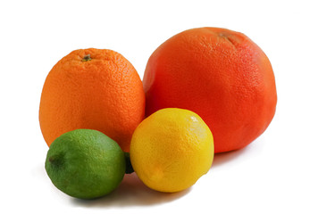 colored bright whole citrus fruits on a white background