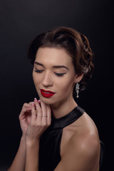 Beautiful gorgeous woman with elegant wavy hairstyle, bright make up.