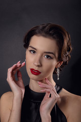 Beautiful gorgeous woman with elegant wavy hairstyle, bright make up.