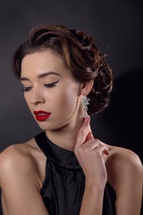 Beautiful gorgeous woman with elegant wavy hairstyle, bright make up.