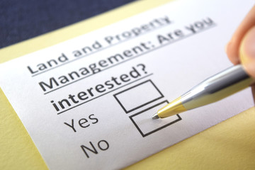 Obraz premium One person is answering question about land and property management.